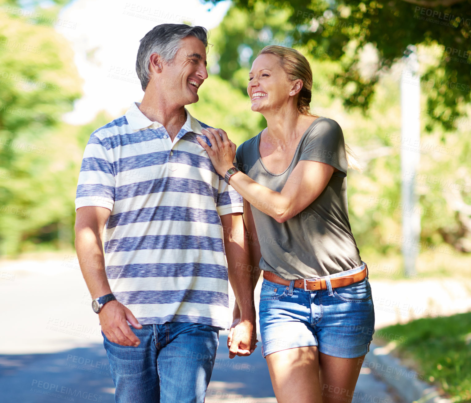 Buy stock photo Cropped shot of an affectionate mature couple enjoying a day in the park