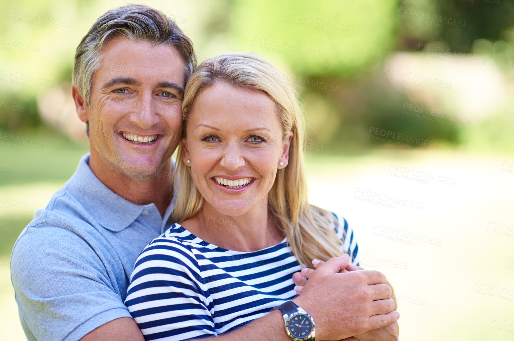 Buy stock photo Cropped shot of an affectionate mature couple enjoying a day in the park