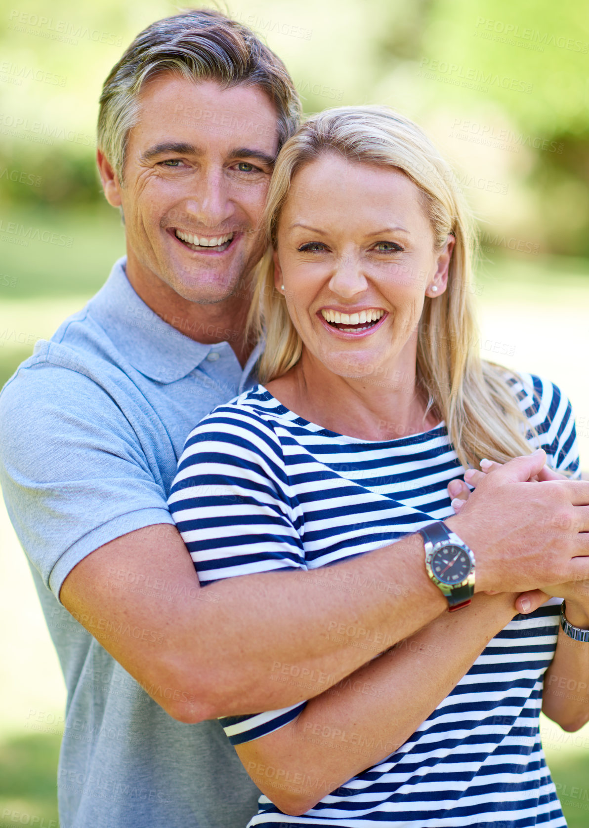 Buy stock photo Cropped shot of an affectionate mature couple enjoying a day in the park