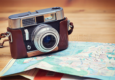 Buy stock photo Travel, map and photography with camera on table for itinerary schedule, adventure explore and direction. Holiday, vintage and trip with vacation planning for tourism, navigation and discovery