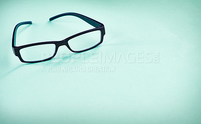 Buy stock photo Glasses, optometry and studio background for frame, trendy style and tool for eyesight. Spectacles, mockup space and product for vision healthcare, ophthalmology and optical insurance for eye care