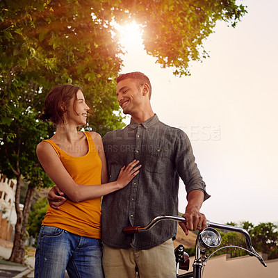 Buy stock photo Shot of a young couple spending time outdoors