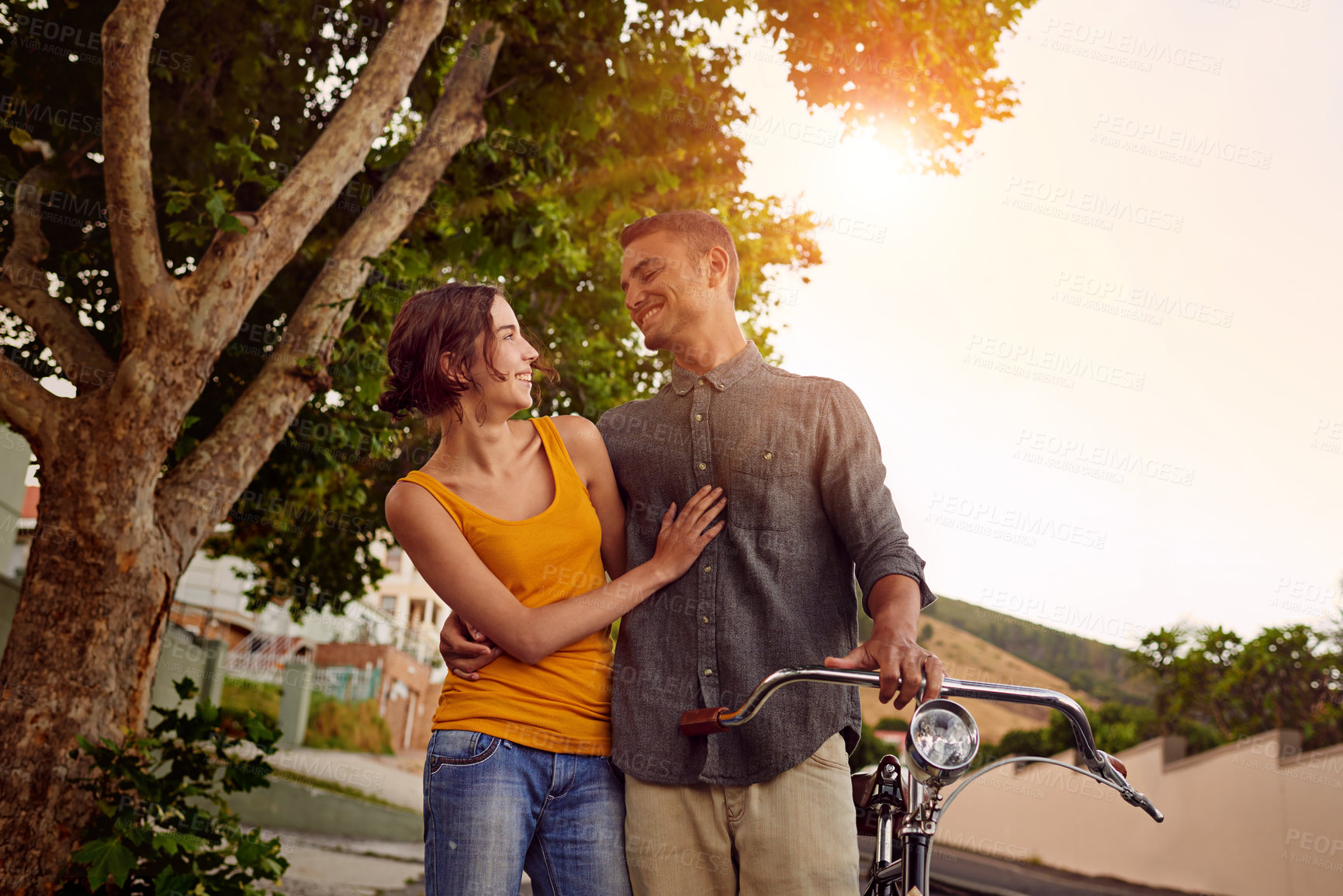 Buy stock photo Shot of a young couple spending time outdoors