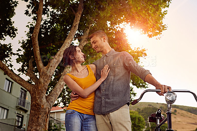 Buy stock photo Shot of a young couple spending time outdoors
