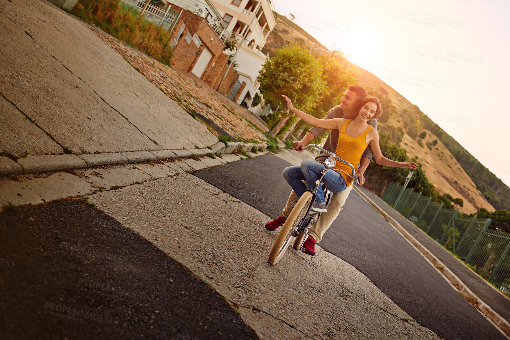 Buy stock photo Happy, couple and ride bicycle outdoor of love, eco friendly transport and bonding together in city. Smile, people and freedom on bike for urban travel, healthy relationship and commitment of journey