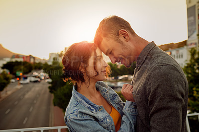 Buy stock photo Happy, couple and hug with love outdoor for vacation, honeymoon and bonding together in city. Smile, people and embracing with support for urban travel, healthy relationship and commitment of romance