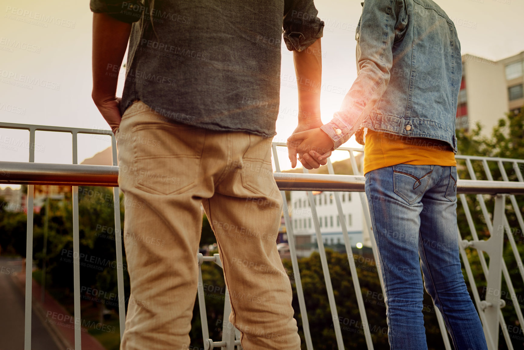 Buy stock photo Holding hands, couple and together for view, bridge and bonding with sightseeing, back and romance. Outdoor, people and trust in relationship, love and date for anniversary, travel and fresh air