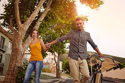 Buy stock photo Portrait, couple and walk with bicycle outdoor of love, eco friendly transport and bonding together in city. Smile, people and bike for travel journey, healthy relationship and commitment of vacation