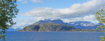 Buy stock photo Landscape, mountains and fjord with ocean, nature and trees with clouds in sky, ecosystem and sustainability. Outdoor, sea and hill with forest, growth and coastal environment in summer in Norway