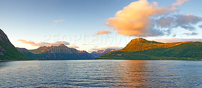 Buy stock photo Landscape, water and mountains with nature, environment and Norway with sunshine, clouds and earth. Empty, blue sky or outdoor with plants, natural aesthetic or tourism with wallpaper or getaway trip