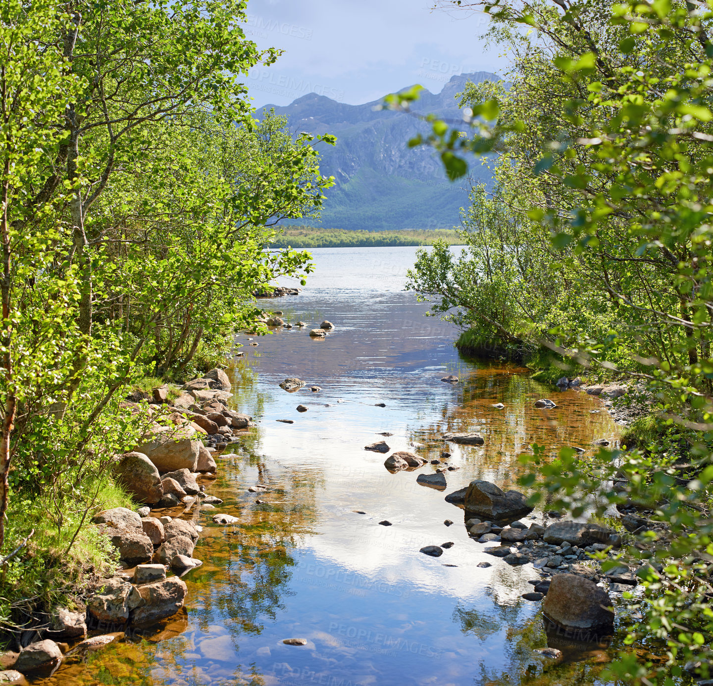 Buy stock photo Landscape of lake and river north of polar and arctic circle in Norland. Mountains and hills in remote area with rocky stream in Bodo, Norway. Traveling abroad and overseas for holiday and vacation