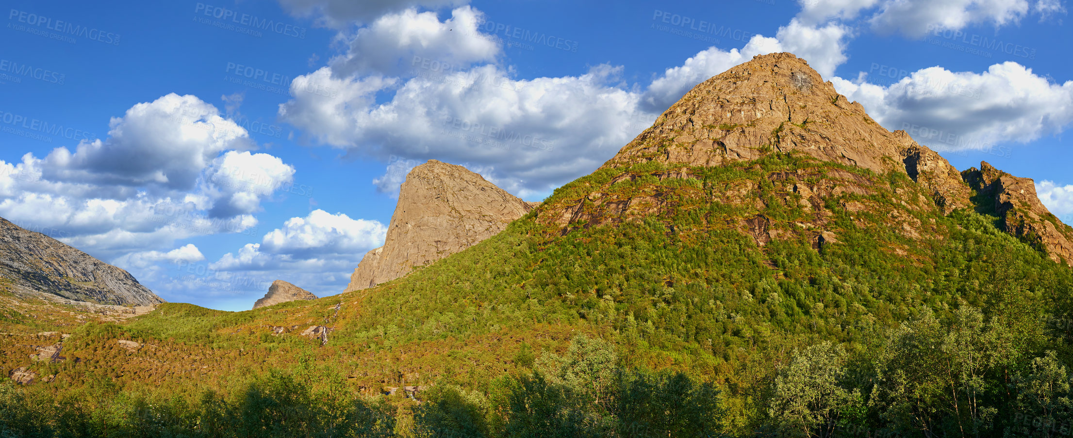 Buy stock photo Mountains, plants and clouds in sky in nature by journey for travel destination in Norway. Environment, landscape and peak for tourism vacation, holiday or trip to landmark in countryside scenery.
