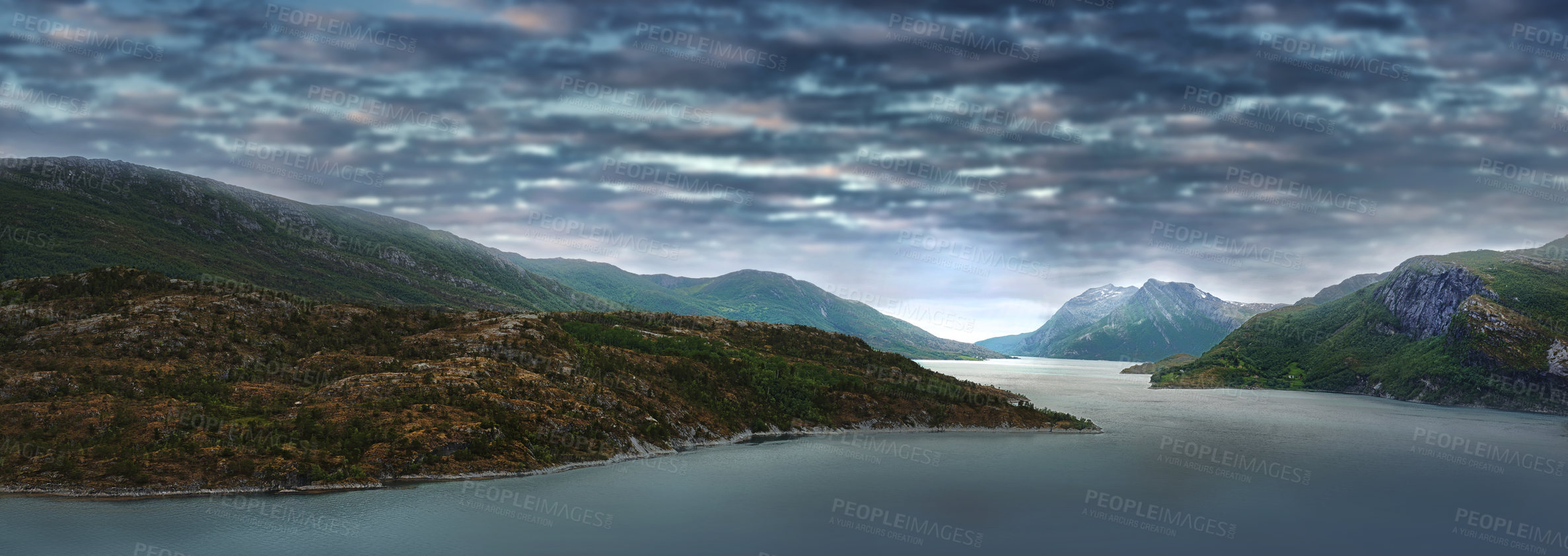 Buy stock photo Landscape of mountains and dark overcast clouds at sunset in the polar and arctic circle in Norway. Scenic panorama view of barren hills in remote area. Travel abroad for holiday and vacation