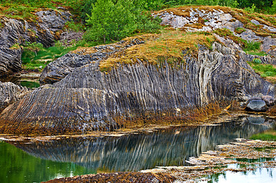 Buy stock photo Landscape, water and rocks with nature, environment and Norway with sunshine, moss and earth. Empty, reflection or outdoor with plants, natural aesthetic or tourism with wallpaper or getaway trip