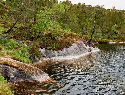 Buy stock photo Landscape, countryside and nature with water, river and green trees in Norway for eco friendly. Environment, earth and stream with grass, rocks and plants for travel, ecology and sustainability