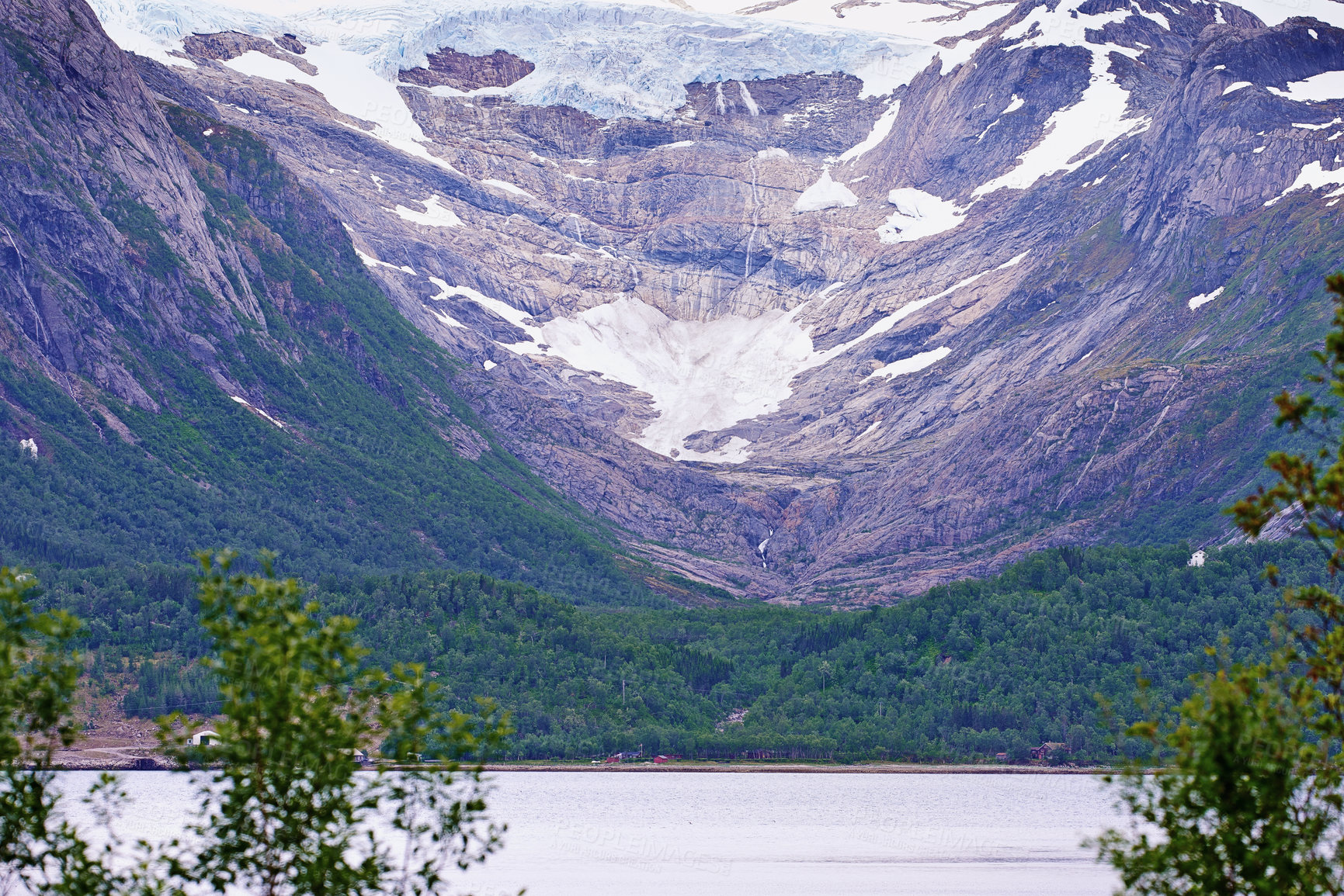 Buy stock photo Lake, nature or woods by mountain with snow in environment for travel by river in Canada. Forest, ice glacier or landscape for winter vacation or holiday by trees in countryside outdoor on background