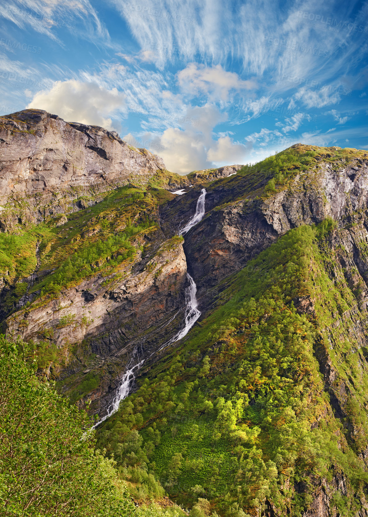 Buy stock photo Blue sky, woods and mountain stream with forest in summer for travel, climbing and hiking. Landscape, nature and view of green environment, clouds and Norway countryside for calm adventure on rocks