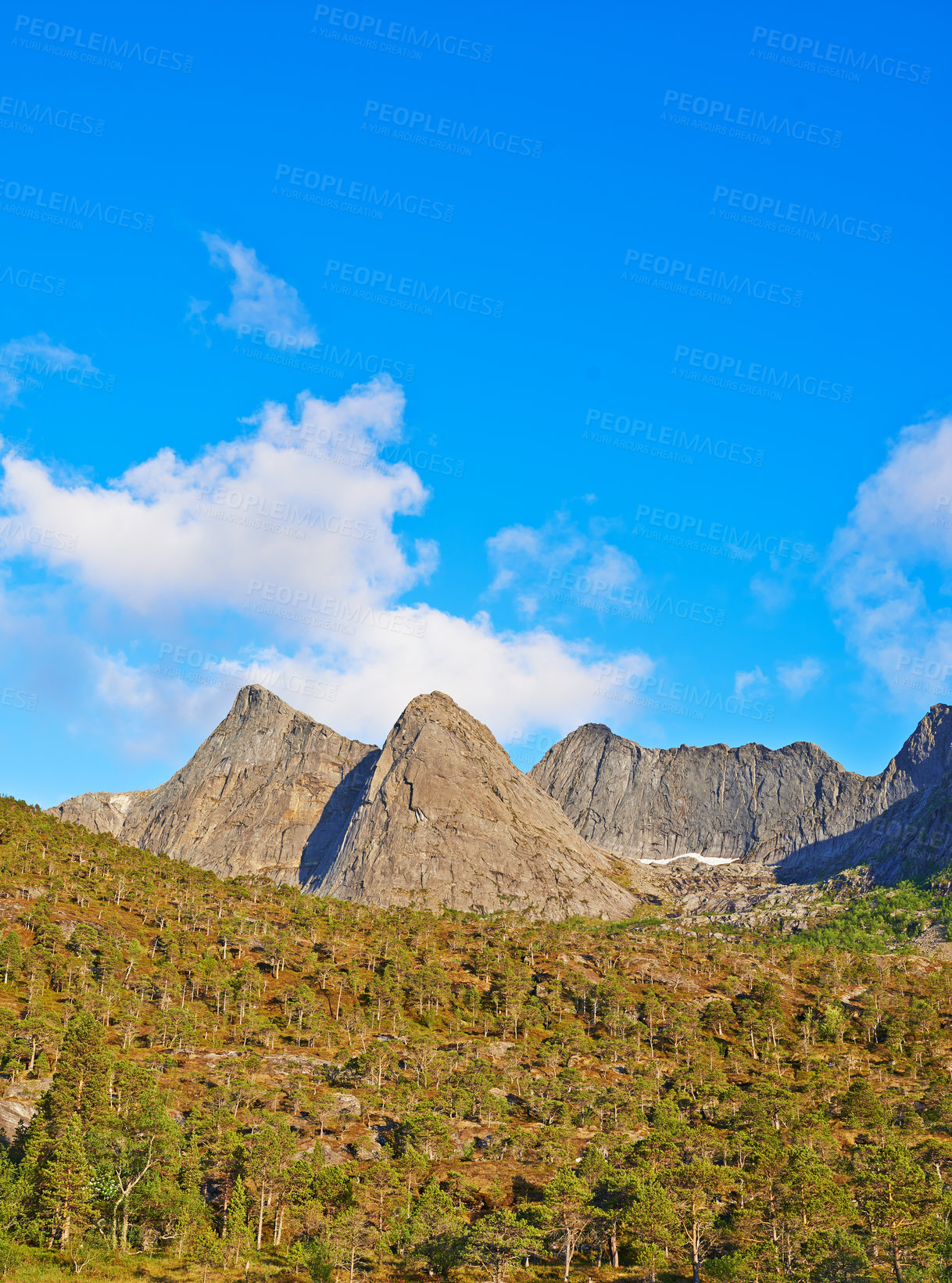 Buy stock photo Mountains, trees and clouds in sky in nature by journey for travel destination in Norway. Environment, landscape and peak for tourism vacation, holiday or trip to landmark in countryside scenery.