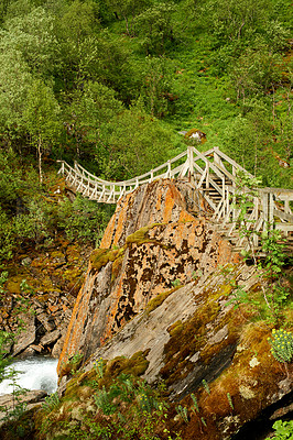 Buy stock photo Forest, landscape and mountain for nature in summer Norway, wood bridge and sustainable environment for travel. Green, jungle and ecology with woods, peace and eco friendly of outdoor adventure 