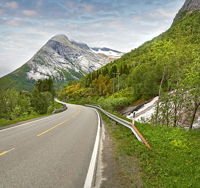 Buy stock photo Highway, mountains and Sweden for travel, journey and tourism with snow melting in spring, environment and nature. Road for getaway, adventure and holiday or vacation destination with green landscape