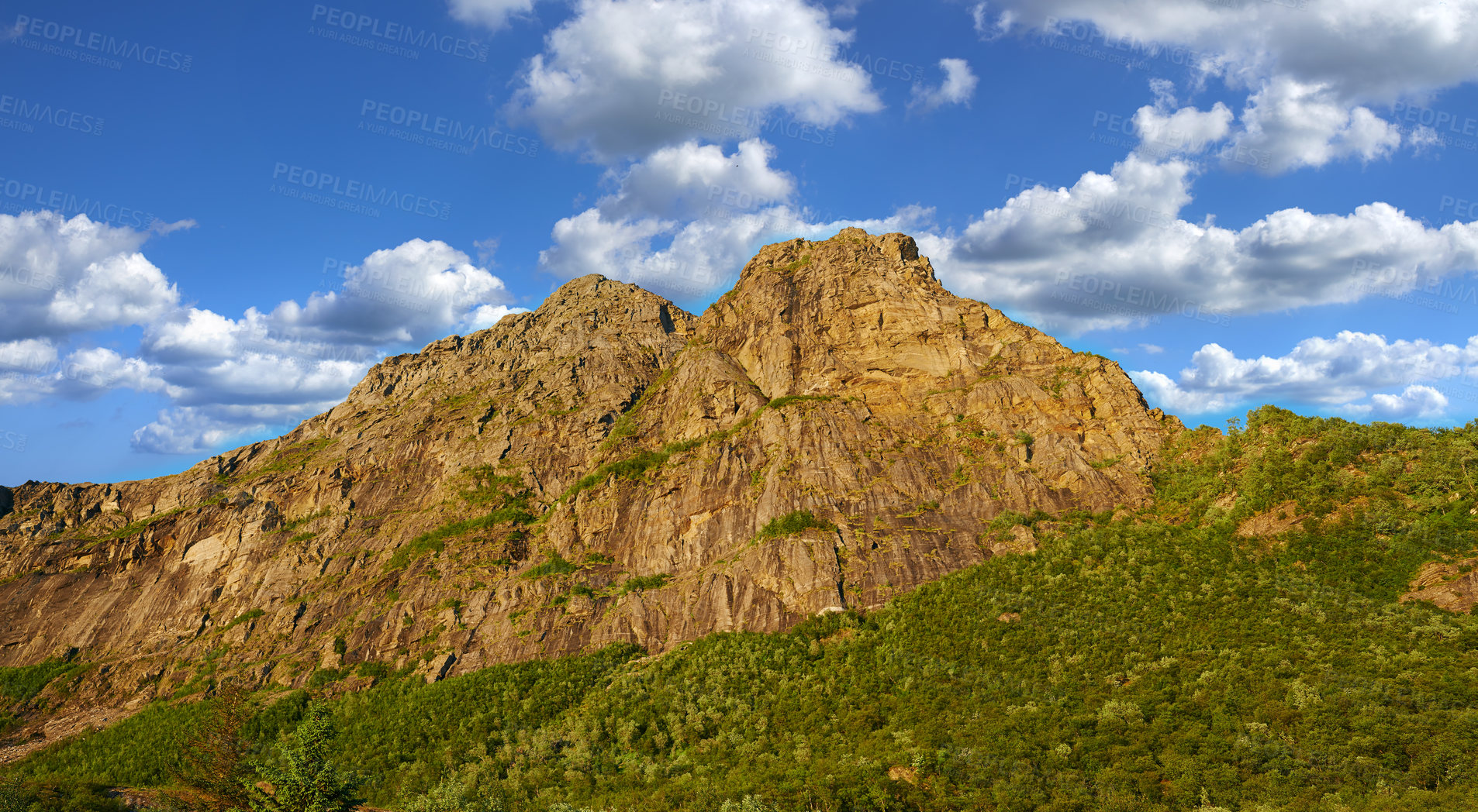 Buy stock photo Mountain, outdoor and clouds in blue sky in nature by journey for travel destination in Norway. Background, landscape and hill peak for tourism vacation, holiday or trip to landmark in countryside.