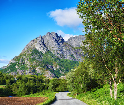 Buy stock photo Forest, road and outdoor with sky by mountains, nature and trees for transport system in summer. Landscape, woods and hill with highway, infrastructure and travel in environment by street in Norway