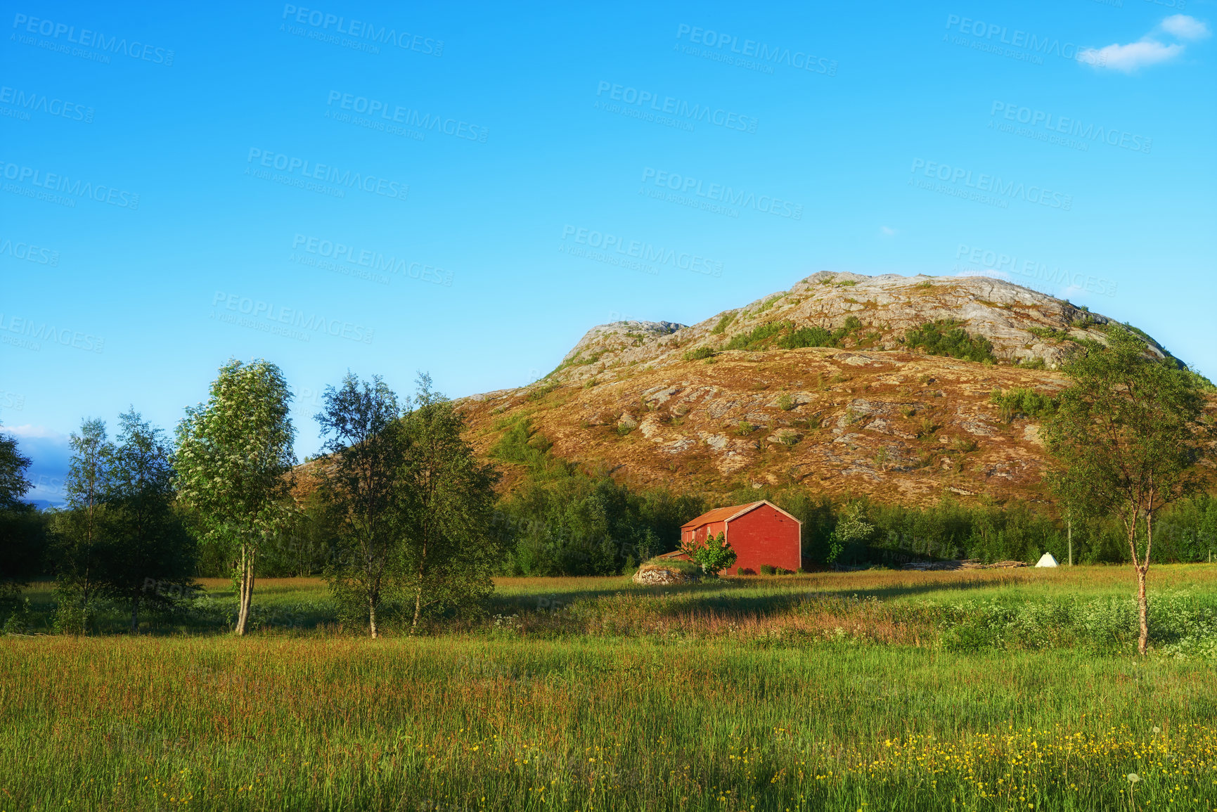 Buy stock photo Field, countryside and outdoor travel for peace, norway and mountain environment for nature. Barn, ecology and green location for earth vacation or holiday, rural building and sustainable aesthetic