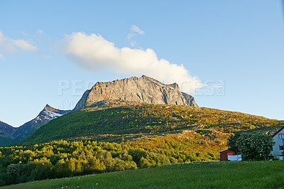 Buy stock photo Mountain, greenery and clouds in sky in nature by journey for travel destination in Norway. Environment, landscape and hill outdoor for tourism vacation, holiday or trip to landmark in countryside.