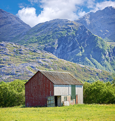 Buy stock photo Nature, field and barnyard in countryside for architecture, landscape or rustic property. Empty, rural and farm house in Sweden with mountain for environment, sustainability or agriculture community