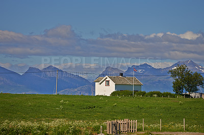 Buy stock photo Nature, field and farm house in countryside for architecture, landscape or rustic property. Empty, tree and vintage home in Switzerland for environment, sustainability or agriculture community