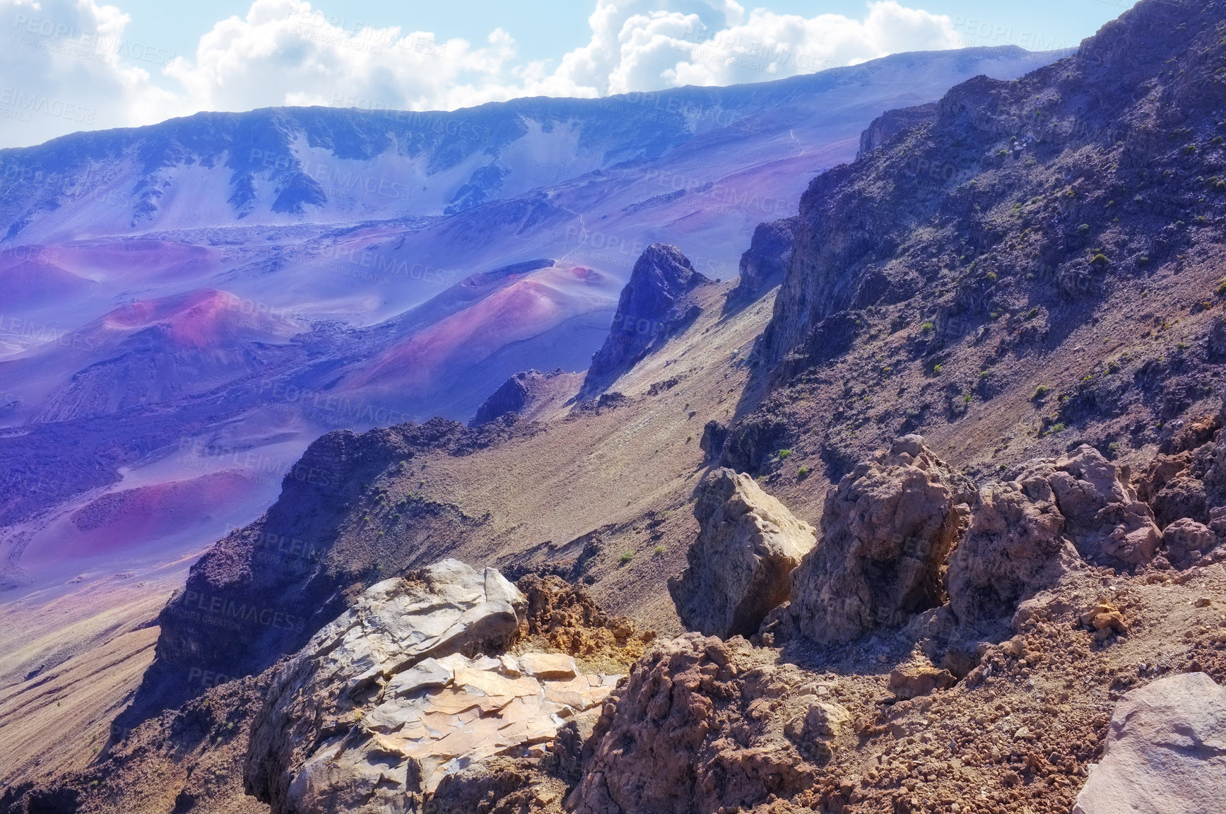 Buy stock photo Nature, volcano and mountains in environment for travel, vacation or holiday outdoor sightseeing. Clouds, Hawaii and wilderness for tourism weekend trip for geology in Haleakala national park.
