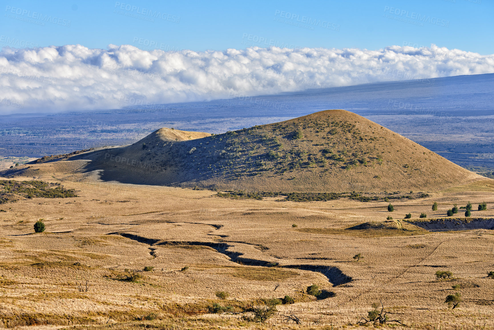 Buy stock photo Desert, mountain and clouds in blue sky in nature with eco friendly, travel and tourism location. Landscape, safari and hill in wilderness for sightseeing destination on vacation or holiday in Hawaii