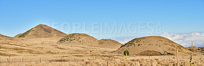 Buy stock photo Desert, volcano and blue sky in nature environment with eco friendly, travel and tourism location. Landscape, banner and outdoor wilderness for sightseeing Mauna Kea destination on holiday in Hawaii.