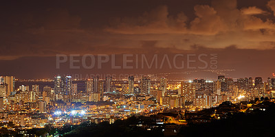 Buy stock photo Cityscape, night and lights with city, buildings and popular tourist or vacation destination in Waikiki honolulu. Luxury travel, skyscrapers and scenic landscape with coast, sunset or holiday evening