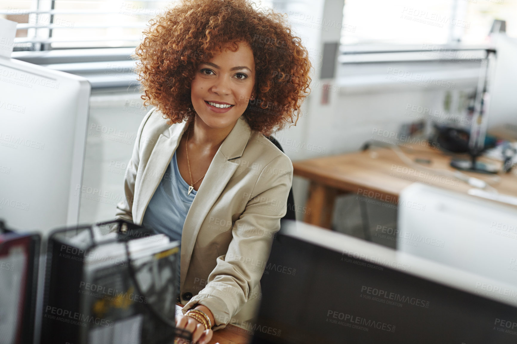 Buy stock photo Cropped shot of a beautiful young businesswoman sitting in her office