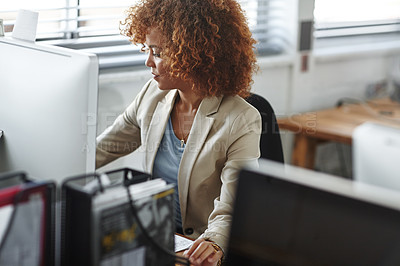 Buy stock photo Cropped shot of a beautiful young businesswoman sitting in her office