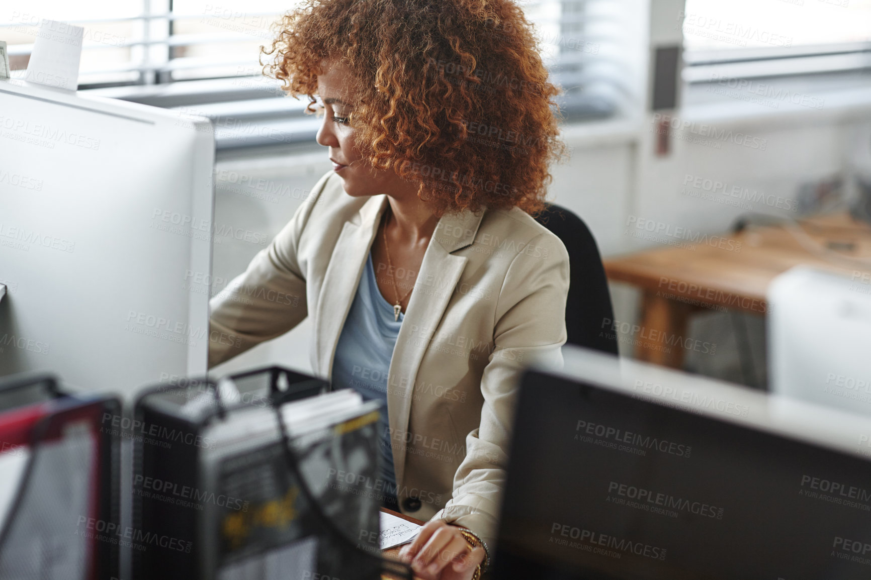 Buy stock photo Cropped shot of a beautiful young businesswoman sitting in her office