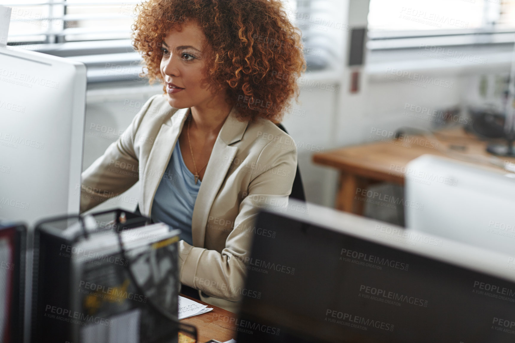 Buy stock photo Cropped shot of a beautiful young businesswoman sitting in her office