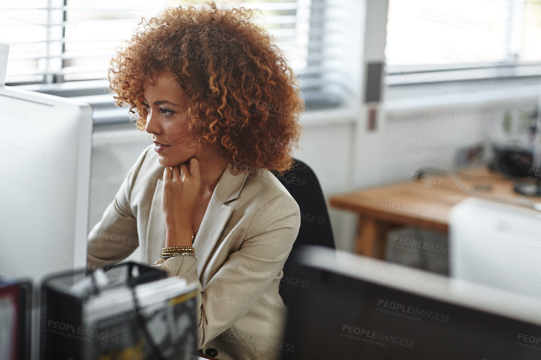 Buy stock photo Cropped shot of a beautiful young businesswoman sitting in her office