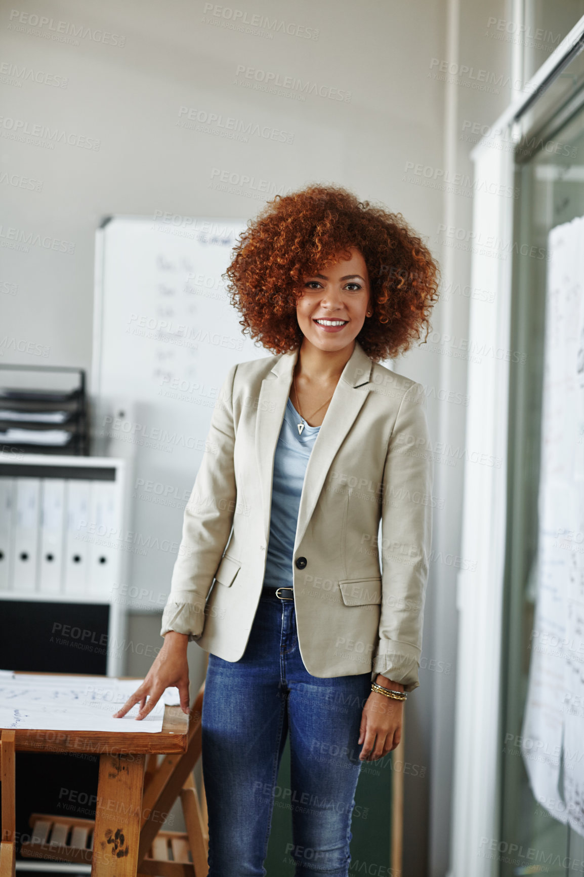 Buy stock photo Cropped shot of a beautiful young businesswoman standing in her office