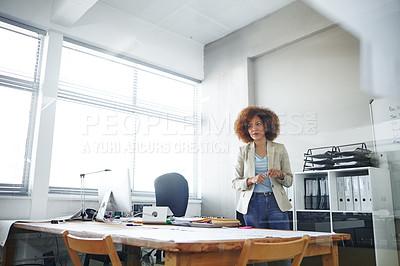 Buy stock photo Shot of a businesswoman working in an office