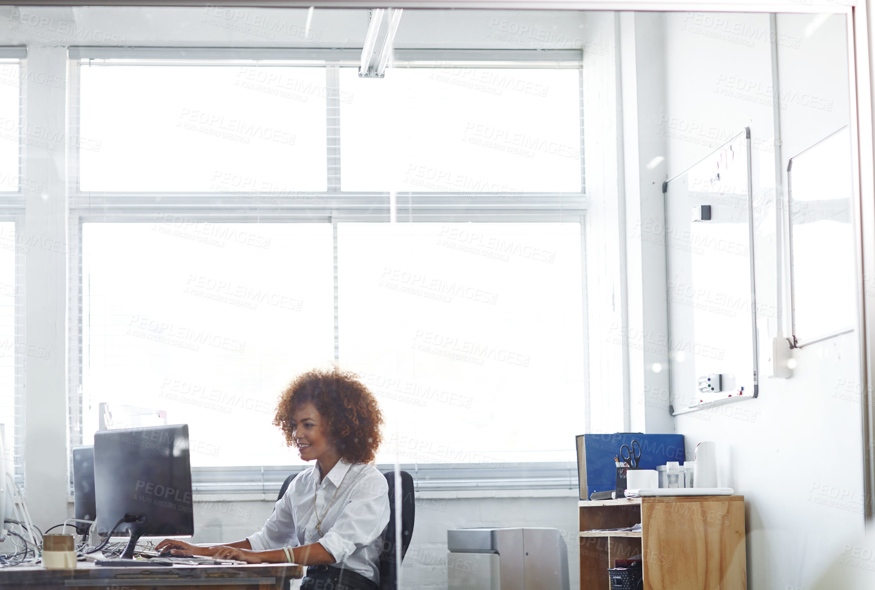 Buy stock photo Cropped shot of a beautiful young businesswoman in her office