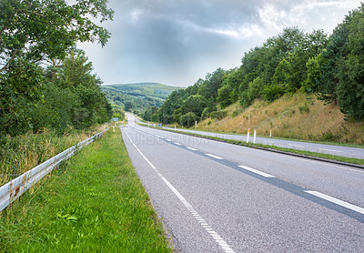 Buy stock photo Road, adventure and pathway to travel, outdoor and peace in environment, location and nature in forest. Woods, highway and direction of destination for journey, morning and trees on trip or landscape