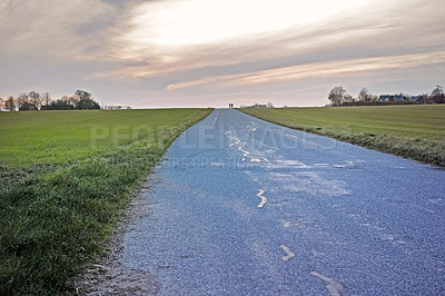 Buy stock photo Travel, field and sky with road in countryside for sunset, environment or destination. Empty, nature and street with outdoor for sustainability, vacation journey or adventure landscape in Switzerland