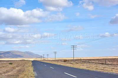 Buy stock photo Road, highway or asphalt in nature for travel, direction and trip to California with grass on land. Street, countryside or outdoor path for journey, vacation or holiday with clouds in sky by mountain