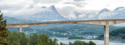 Buy stock photo Nature, bridge and mountain with clouds view for environment architecture, landscape and highway road. Norway, natural beauty and travel adventure, structure and snow scenery for journey outdoor