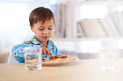 Buy stock photo Child, eating and breakfast at kitchen table for healthy, hungry and sandwich in house. Morning, food and water for meal at home with bread, glass and boy inside for snack, nutrition and vitality