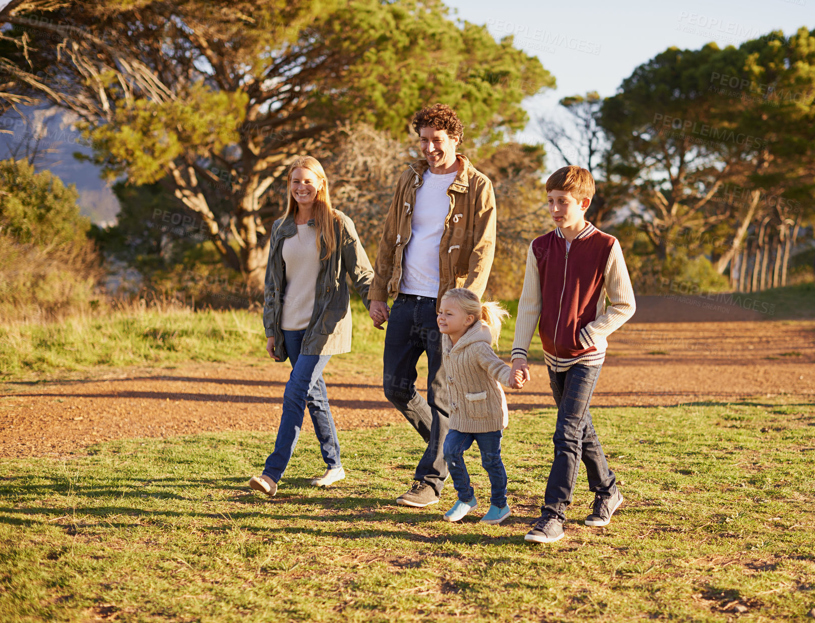 Buy stock photo Happy, family and children on nature walk, summer fun for health in morning. Exercise in forest with kids holding hands, smile in field on vacation or holiday with people together in calm outdoors