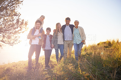 Buy stock photo Full length portrait of a happy multi-generational family on an afternoon walk