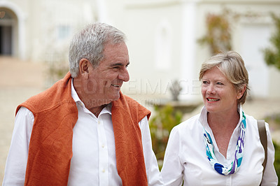 Buy stock photo Smile, conversation and a senior couple in the city for a retirement holiday, travel and happiness. Happy, love and an elderly man and woman walking in an old town or hotel during a vacation together